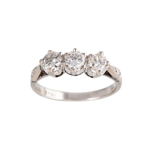 110 - A THREE STONE DIAMOND RING, the brilliant cut diamonds to diamond set shoulders, mounted in 18ct whi... 