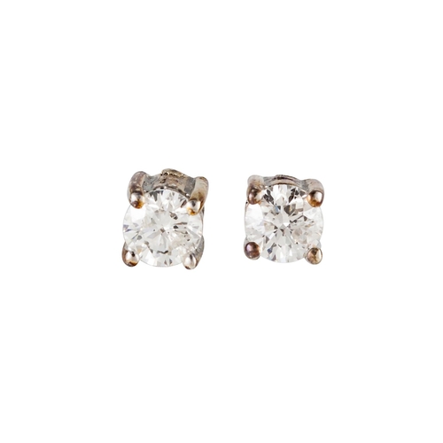 117 - A PAIR OF DIAMOND STUD EARRINGS, the brilliant cut diamonds mounted in gold. Estimated; weight of di... 