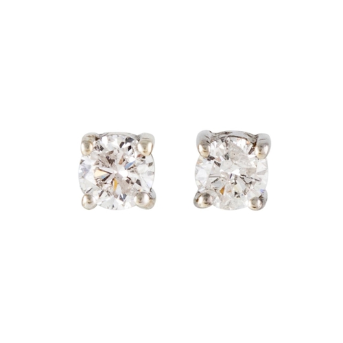 127 - A PAIR OF DIAMOND STUD EARRINGS, the brilliant cut diamonds mounted in gold. Estimated; weight of di... 