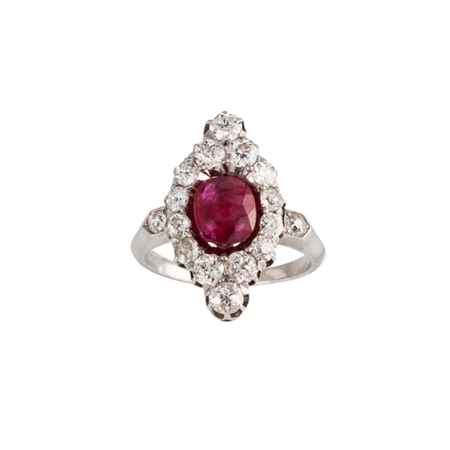 129 - AN ANTIQUE RUBY AND DIAMOND CLUSTER RING, of navette form, the cushion cut ruby to an old cut diamon... 