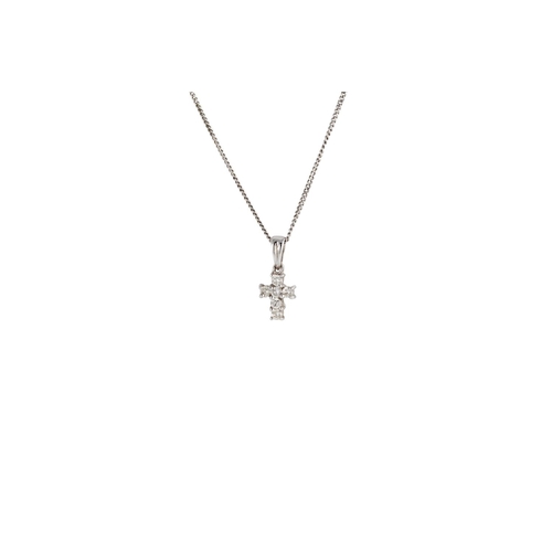 144 - A DIAMOND SET CROSS, the brilliant cut diamonds mounted in 18ct white gold, on a 9ct white gold trac... 