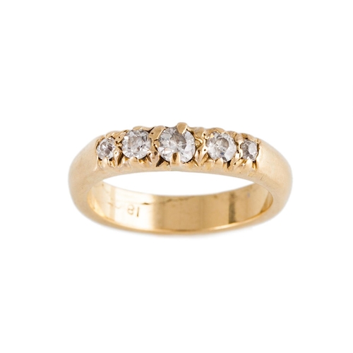 150 - A FIVE STONE DIAMOND RING, the brilliant cut diamonds mounted in 18ct yellow gold. Estimated; weight... 