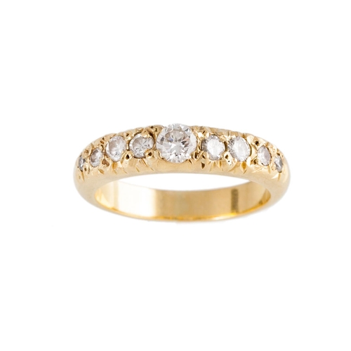 151 - A NINE STONE DIAMOND RING, the brilliant cut diamonds mounted in yellow gold. Estimated; weight of d... 