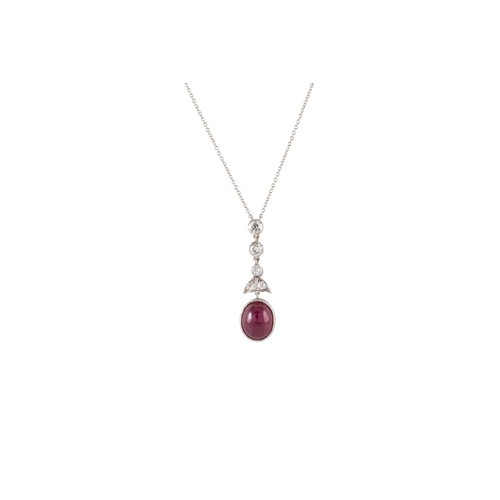 539 - A RUBY AND DIAMOND PENDANT, comprising a line of old cut diamonds suspending a oval ruby cabachon, t... 