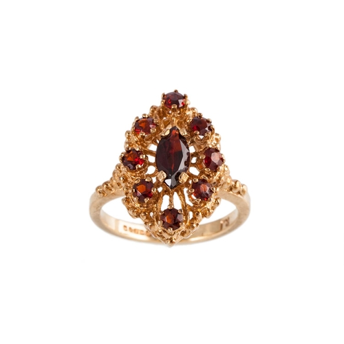 68 - A GARNET CLUSTER RING, of navette form, set with a marquise and circular stones, mounted in 9ct yell... 