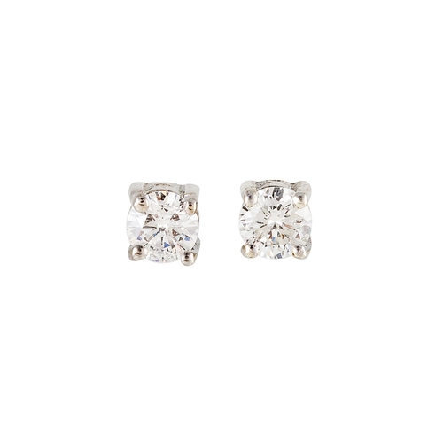 76 - A PAIR OF DIAMOND STUD EARRINGS, the brilliant cut diamonds mounted in white gold. Estimated; weight... 