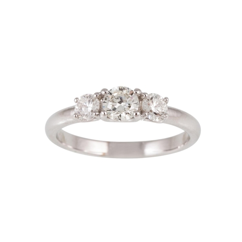 97 - A THREE STONE DIAMOND RING, the brilliant cut diamonds mounted in 18ct white gold. Estimated; weight... 