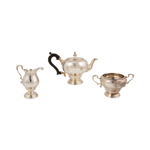 478 - A MODERN THREE PIECE IRISH SILVER TEA SERVICE, chased and engraved decoration, by Royal Irish Ltd. D... 