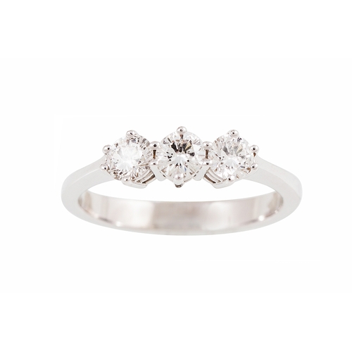 38 - A THREE STONE DIAMOND RING, the brilliant cut diamonds mounted in 18ct white gold. Estimated; weight... 