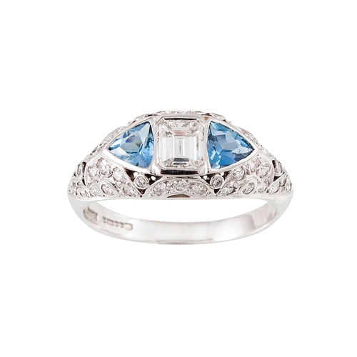 248 - AN AQUAMARINE AND DIAMOND DRESS RING, the emerald cut diamond flanked by trillion cut aquas, diamond... 