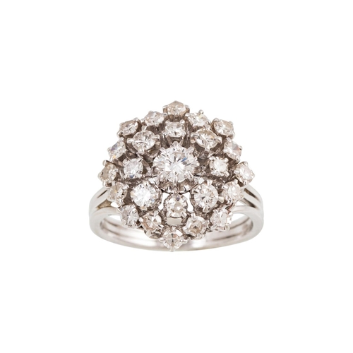 380 - A DIAMOND CLUSTER RING, the brilliant cut diamonds mounted in 18ct white gold, French hallmarks. Est... 