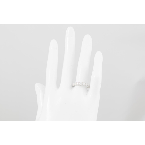 102 - A DIAMOND ETERNITY RING, the graduated brilliant cut diamonds mounted in 18ct white gold. Estimated:... 