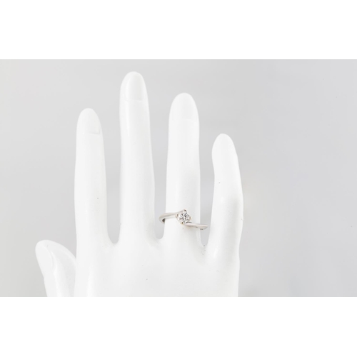 117 - A DIAMOND SOLITAIRE RING, the brilliant cut diamond mounted in an 18ct white gold twist mount. Estim... 