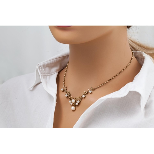 121 - AN ATTRACTIVE FRESH WATER PEARL NECKLACE with belcher link chain,mounted in 9ct yellow gold.