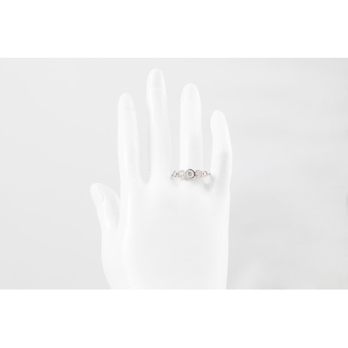 129 - A FIVE STONE DIAMOND RING, the graduated brilliant cut diamonds collet set in 18ct gold. Estimated: ... 