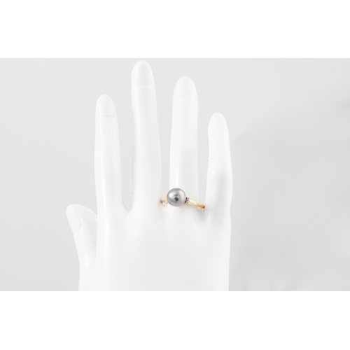 133 - A DIAMOND AND BLACK PEARL RING, mounted in 14ct gold, size R - S.