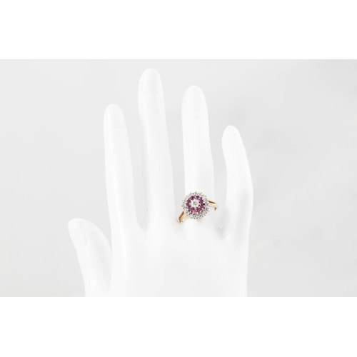 141 - A DIAMOND AND RUBY CLUSTER RING, of circular form, mounted in 9ct yellow gold. Estimated: weight of ... 