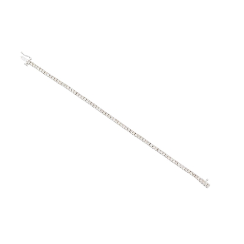 142 - A DIAMOND LINE BRACELET, the princess cut diamonds mounted in 9ct white gold. Estimated: weight  of ... 