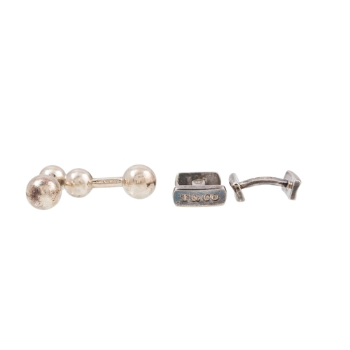 144 - TWO PAIRS OF SILVER CUFFLINKS, stamped Tiffany & Co, together with a pair of collar stays, stamped T... 