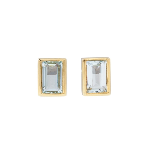 166 - A PAIR OF AQUAMARINE EARRINGS, the rectangular stones mounted in 14ct yellow gold. Estimated: weight... 