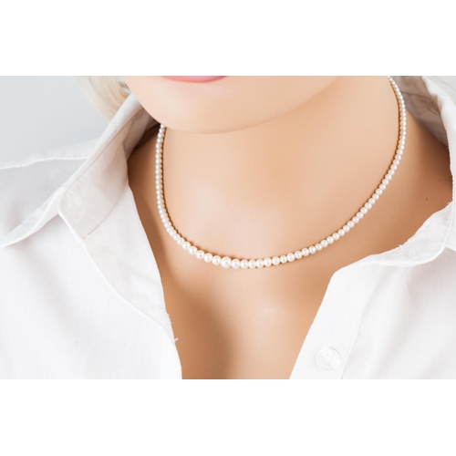 173 - A PEARL NECKLACE, the graduating pearls measuring 2.5 - 5 mm, to an 18ct gold diamond set boat shape... 