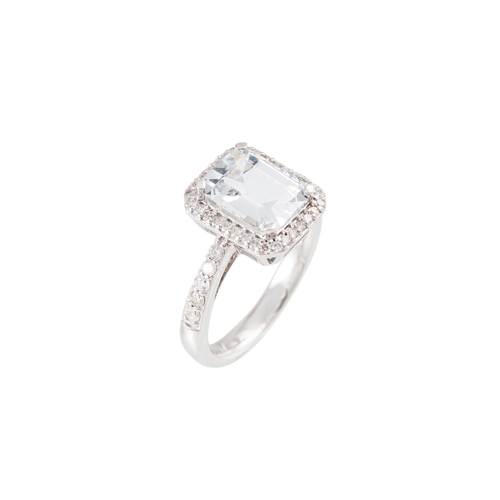 204 - a WHITE SAPPHIRE AND DIAMOND CLUSTER RING, the centre sapphire to diamond surround and shoulders, mo... 