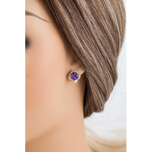 233 - A PAIR OF AMETHYST AND DIAMOND CLUSTER EARRINGS, the cushion shaped amethysts to diamond points, mou... 