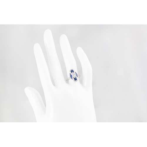 245 - A SAPPHIRE AND DIAMOND PLAQUE CLUSTER RING, in the Art Deco style, the centre diamond to a diamond a... 