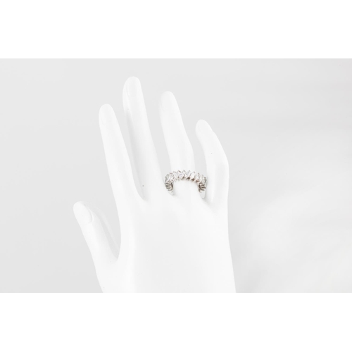 261 - A DIAMOND ETERNITY RING, the marquise cut diamonds mounted in 18ct white gold. Estimated: weight of ... 