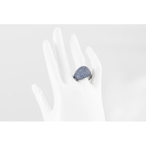 262 - A PURPLE SAPPHIRE SET DRESS RING, the sapphires pavé set in black Rhodium plated 18ct gold. Estimate... 