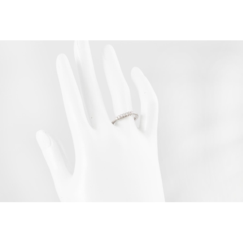 277 - A SEVEN STONE DIAMOND RING, the brilliant cut diamonds mounted in white 18ct gold. Estimated: weight... 