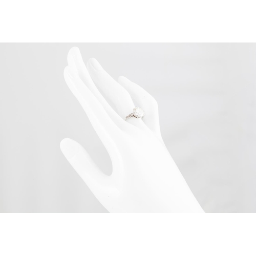 286 - A VINTAGE DIAMOND SOLITAIRE RING, the brilliant cut diamond to old cut diamond set shoulders, mounte... 