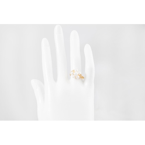 311 - A PEARL AND DIAMOND RING, the pearl cluster to diamond shoulders, mounted in 18ct yellow gold. Estim... 