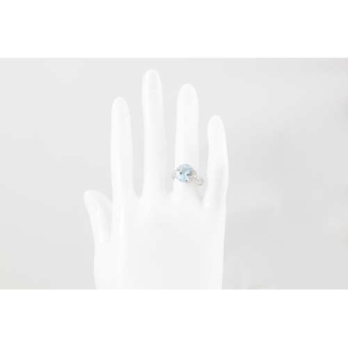 319 - AN AQUAMARINE AND DIAMOND RING, the oval aquamarine to diamond shoulders, mounted in 18ct white gold... 