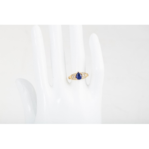 383 - A SAPPHIRE AND DIAMOND RING, the pear shaped sapphire to diamond shoulders, mounted in yellow gold. ... 