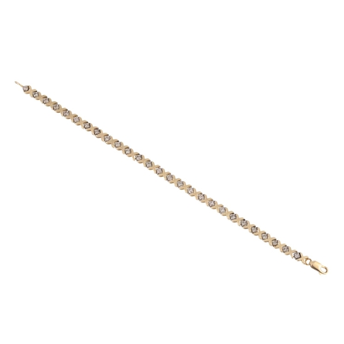 43 - A DIAMOND BRACELET, the circular diamonds set between x shaped links, mounted in 10ct gold. Estimate... 