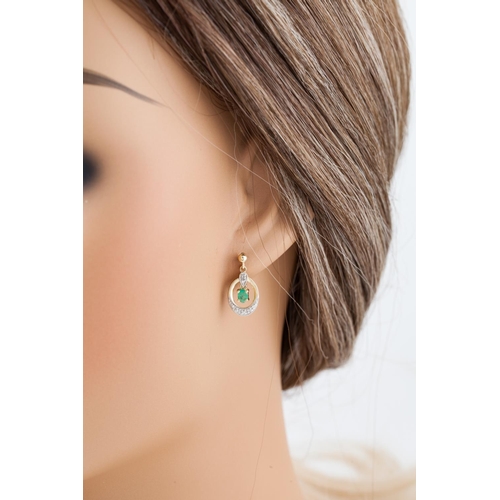 79 - A PAIR OF EMERALD AND DIAMOND DROP EARRINGS, the emerald drops within openwork diamond set ovals, mo... 