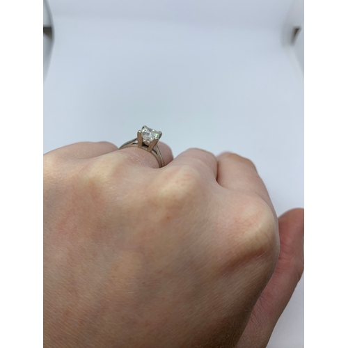 298 - A DIAMOND SOLITAIRE RING, the princess cut diamond mounted in white metal. Together with EGL Certifi... 