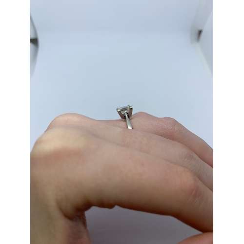 298 - A DIAMOND SOLITAIRE RING, the princess cut diamond mounted in white metal. Together with EGL Certifi... 