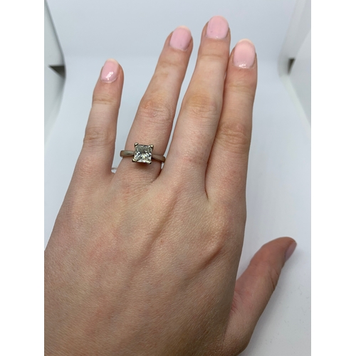 298 - A DIAMOND SOLITAIRE RING, the princess cut diamond mounted in white metal. Together with EGL Certifi... 