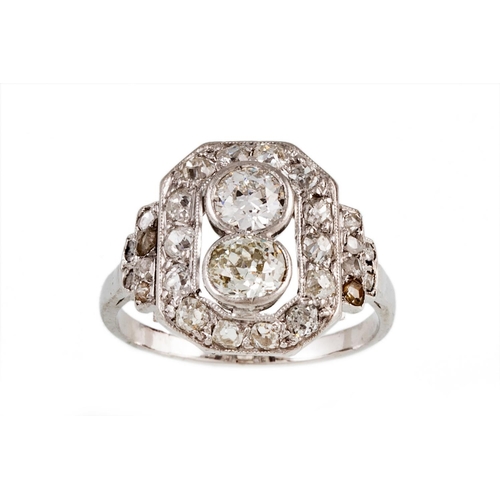 114 - A DIAMOND CLUSTER RING, in the Art Deco style, the two central old cut diamonds to a surround of ros... 