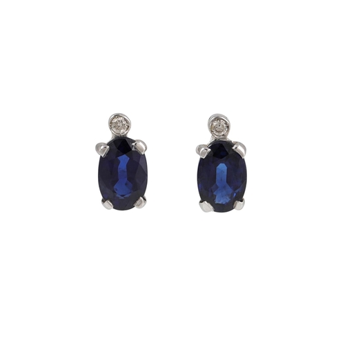 136 - A PAIR OF SAPPHIRE AND DIAMOND STUD EARRINGS, mounted in 18ct white gold