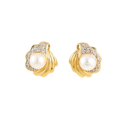 162 - A PAIR OF CULTURED PEARL SET EARRINGS, the pearl set to a diamond set fluted gold surround, mounted ... 