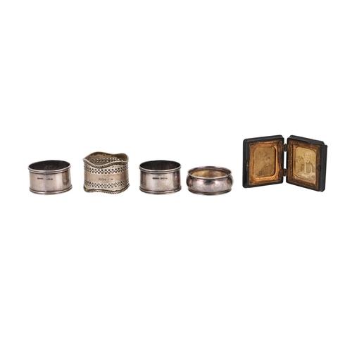 192 - A VARIED COLLECTION OF FOUR MID 20TH CENTURY SILVER HALL MARKED NAPKIN RINGS, together with a Victor... 