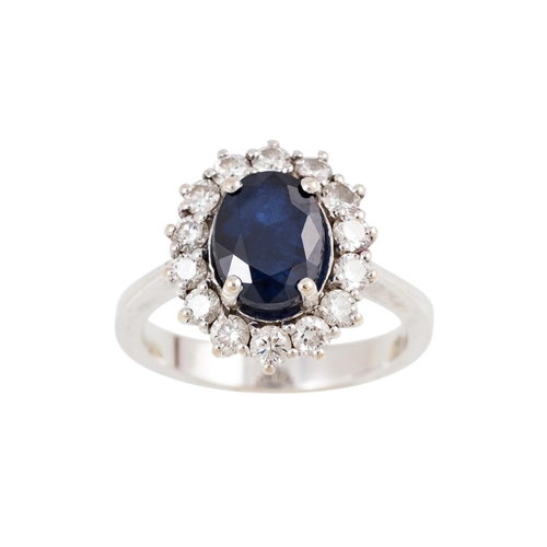 202 - A DIAMOND AND SAPPHIRE CLUSTER RING, mounted in 18ct white gold. Estimated; weight of sapphire; 2.47... 