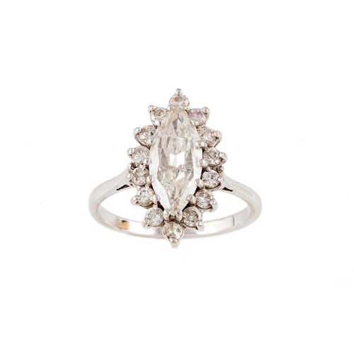 204 - A DIAMOND CLUSTER RING, of navette form, the marquise cut diamond to a brilliant cut diamond surroun... 