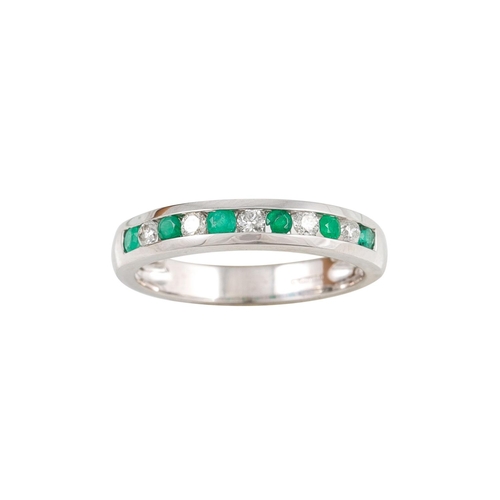 239 - A DIAMOND AND EMERALD HALF ETERNITY RING, channel set.  Estimated: weight of diamonds: 0.20 ct