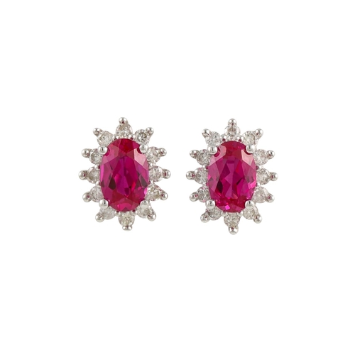 265 - A PAIR OF DIAMOND AND PINK SAPPHIRE EARRINGS, of oval form, mounted in white  gold. Estimated: weigh... 