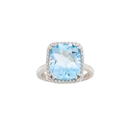 270 - A TOPAZ AND DIAMOND CLUSTER RING, the cushion cut topaz within a diamond border, mounted in 14ct gol... 