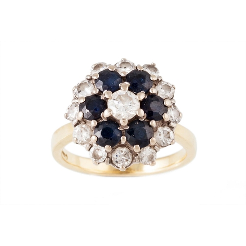 29 - A SAPPHIRE AND DIAMOND CLUSTER RING, mounted in 18ct yellow gold. Estimated; weight of sapphire; 1.8... 